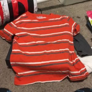 A orange,gray,and white shirt